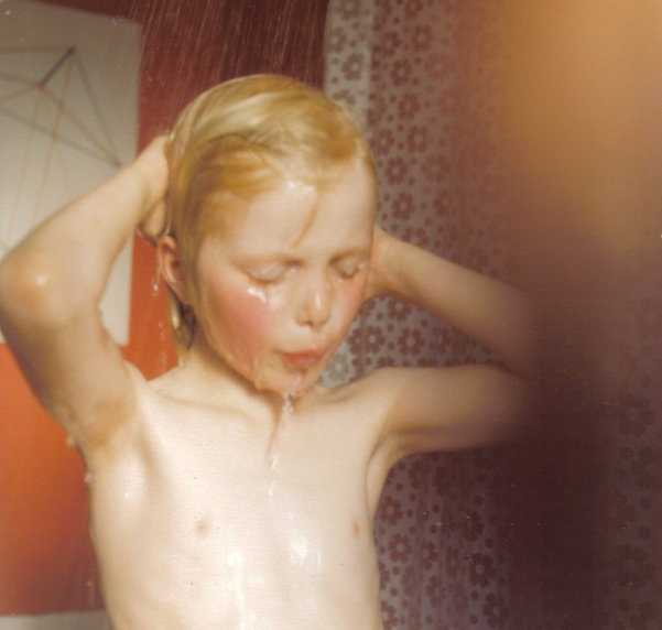 Me in the shower, 1980. Note the dark orange walls, using leftover paint from my bedroom, and the trendy late 70s line design picture